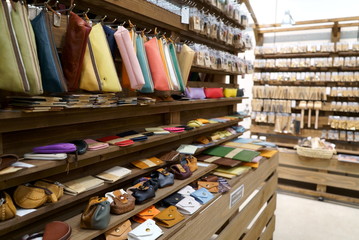 Bokeh image of leather material shelf in craft shop