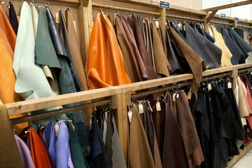 Bokeh image of leather material shelf in craft shop