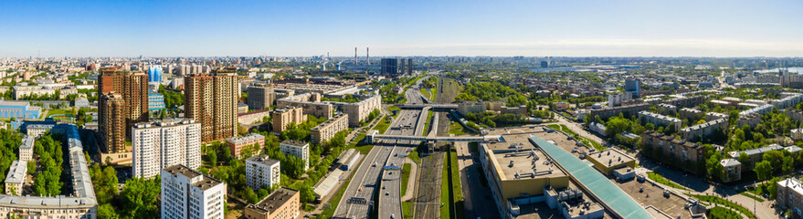 Aerial top view of road junction in Moscow from above, automobile traffic and the old Ugreshskaya railway station in the Moscow industrial zone near the automobile ring highway
