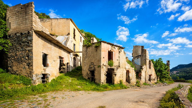 Ruined buildings of an abandoned city. Architecture of a ghost town.