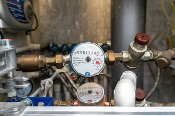 turn off hot water. plumbing cabinet. water meters, collector, water pressure sensor