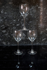 three glass cups on black background
