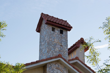 Roof element of a mansion with a chimney