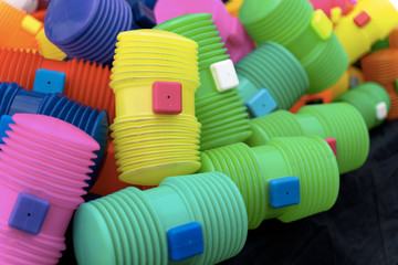 Bright multicoloured plastic toy hammers and bunting for celebrating the feast of St. John the Baptist in Porto, Portugal