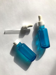 bubble with serum and a dropper in the sunlight. cosmetics for care