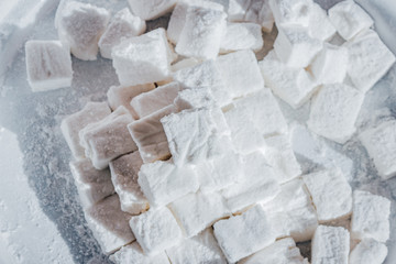 White Homemade Marshmallows with the Mint. Pyramid of Marshmallow. Pile of square Marshmallows.