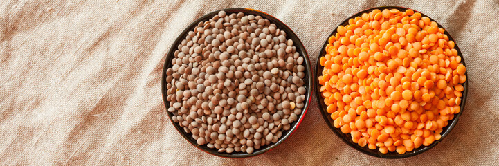 Lentils in a wooden bowl on linen.