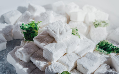 White Homemade Marshmallows with the Mint. Pyramid of Marshmallow. Pile of square Marshmallows.