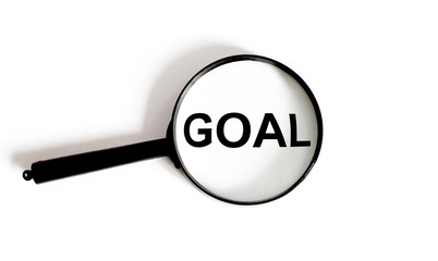 Magnifier with text Goal on the white background