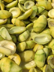 part of Bengali seasonal fruit,the unripened mango, it's seed, it's slices and pieces are arranged. Used as spice during cooking vegetables as aamchoor powder.