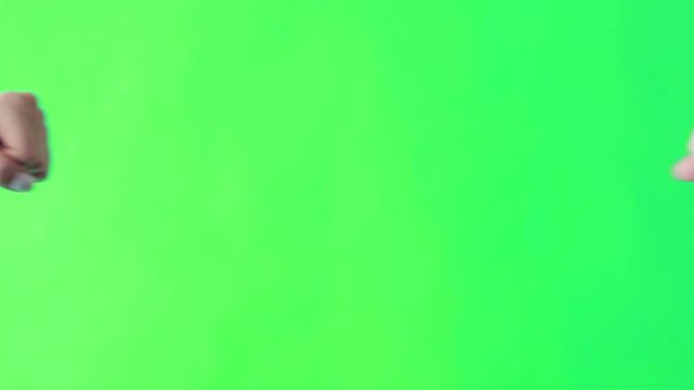Two women fist bumping against white screen.
