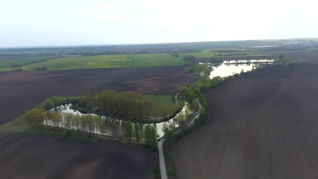 Aerial turnaround view of large fish ponds area in Cetin, Slovakia