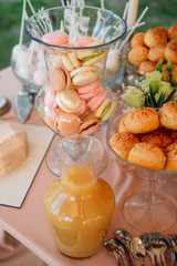 Sweet treats and desserts served on an outdoor table. Candy bar concept.