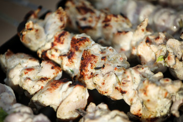 Grilled meat skewers. Barbecue fried on grill. Cooking meat on the coals. Outdoor recreation