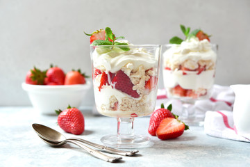 Eton mess - traditional english dessert with meringue, whipped cream and fresh berries.