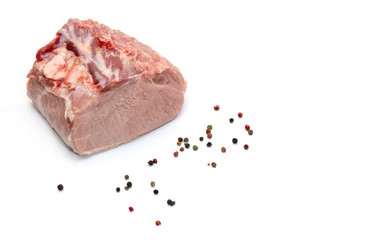 Cue of raw pork before cooking with pepper isolated on a white background.