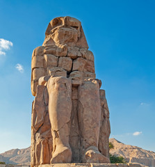 Large statue of Colossus of Memnon in Luxor Egypt