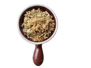 Crackling yellow frame mixed with garlic in a cup placed on the White Background 