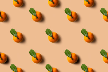 Mandarin pattern isolated on pastel orange background. Fresh fruit.