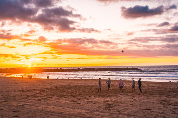 A group of young people playing ball on the beach in the city of San Sebastián, Gipuzkoa. Basque Country