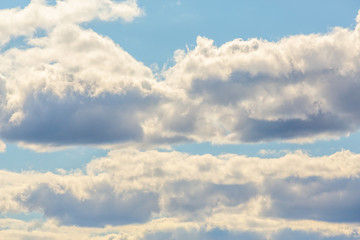 Fototapeta na wymiar White clouds on a background of blue sky.