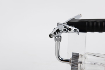 Silver-white pneumatic spray bottle.