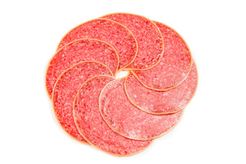 Salami slices isolated on white background.