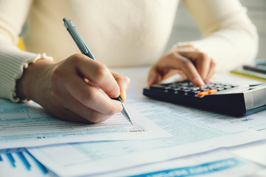  Closeup Woman Filling Form Of Individual Income Tax Return,