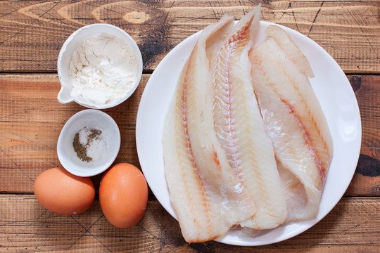 Step-by-step preparation of fried pollock fillet in batter, step 1 - preparation of ingredients, top view, selective focus