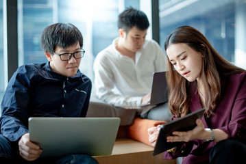 Business meeting and teamwork concept. Asian businesswoman explaining project data report to...