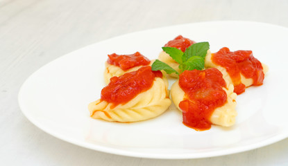 Culurgiones pasta home made with potatoes and mint, a typical traditional pasta from Sardinia
