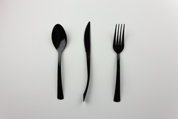 Plastic items. Black appliances for food. For the presentation of waste recycling. Disposable tableware