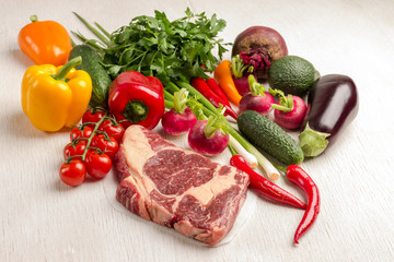 Marbled beef steak with vegetables. Raw meat. Organic food.