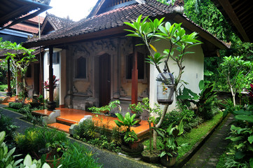 Fototapeta na wymiar Exterior decoration furniture classic antique retro vintage balinese style of garden outdoor for travelers guest travel visit and relax rest at luxurior resort hotel at Ubud city in Bali, Indonesia