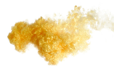 gold paint in water, ink in water splash. color drop in water, yellow brilliantly golden