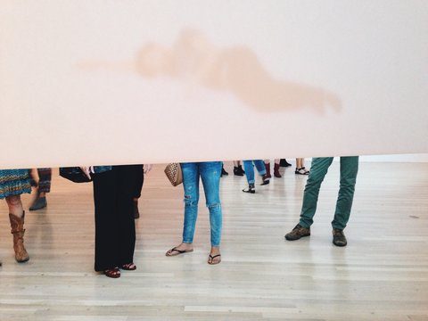 Low Section Of Group Of People Standing Behind Screen Partition