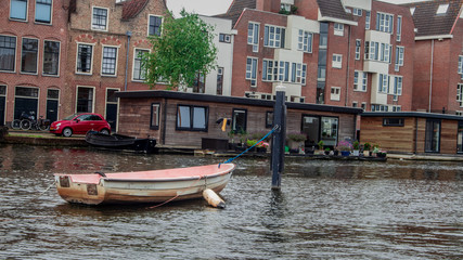 boat docked in canal leiden