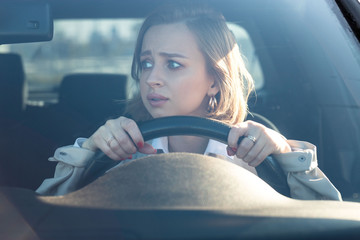 Woman drives her car for the first time, tries to avoid a car accident, is very nervous and scared,...