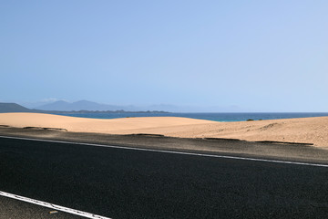 Road with beautiful views of the beach and crosses the dunes