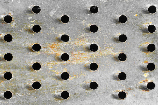 Close-up of metal with holes. texture or background