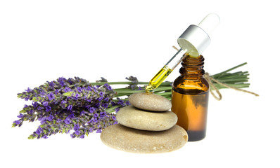 Essential lavender oil in the bottle with dropper isolated on white background. Horizontal close-up.