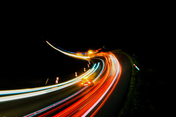 Fototapeta na wymiar lights of cars with night. abstract