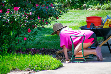 A lady doing yard work