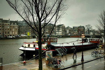 Autumn view of Amstel river in Amsterdam , Netherlands during the rain.