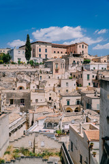 Fototapeta na wymiar View of the narrow streets of the ancient city of Matera on a sunny day. Italy.