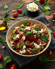 Buckwheat and beetroot salad with mushroom, walnut, spinach and feta cheese. healthy diet food