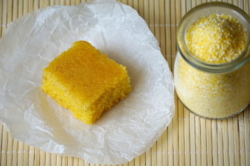 Piece of tasty homemade sweet cornbread, top view