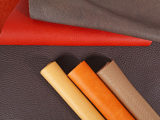 Rolled up multicolored natural leather textures samples