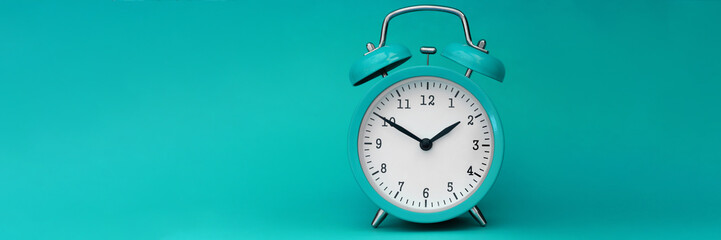 Modern alarm clock turquoise closeup object