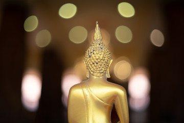Behind of Golden Buddha, Golden Buddha statue at Wat Krathum Suea Pla temple is public place and famous landmark tourist attraction in Thailand